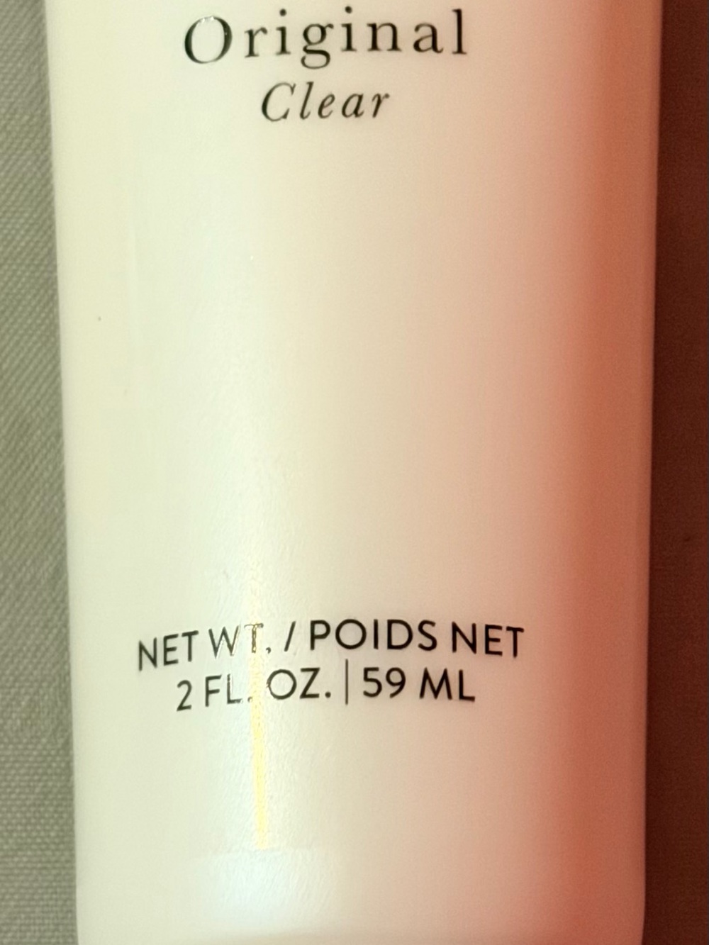 Laura Geller Makeup Primer Tube in Cream and Black Text